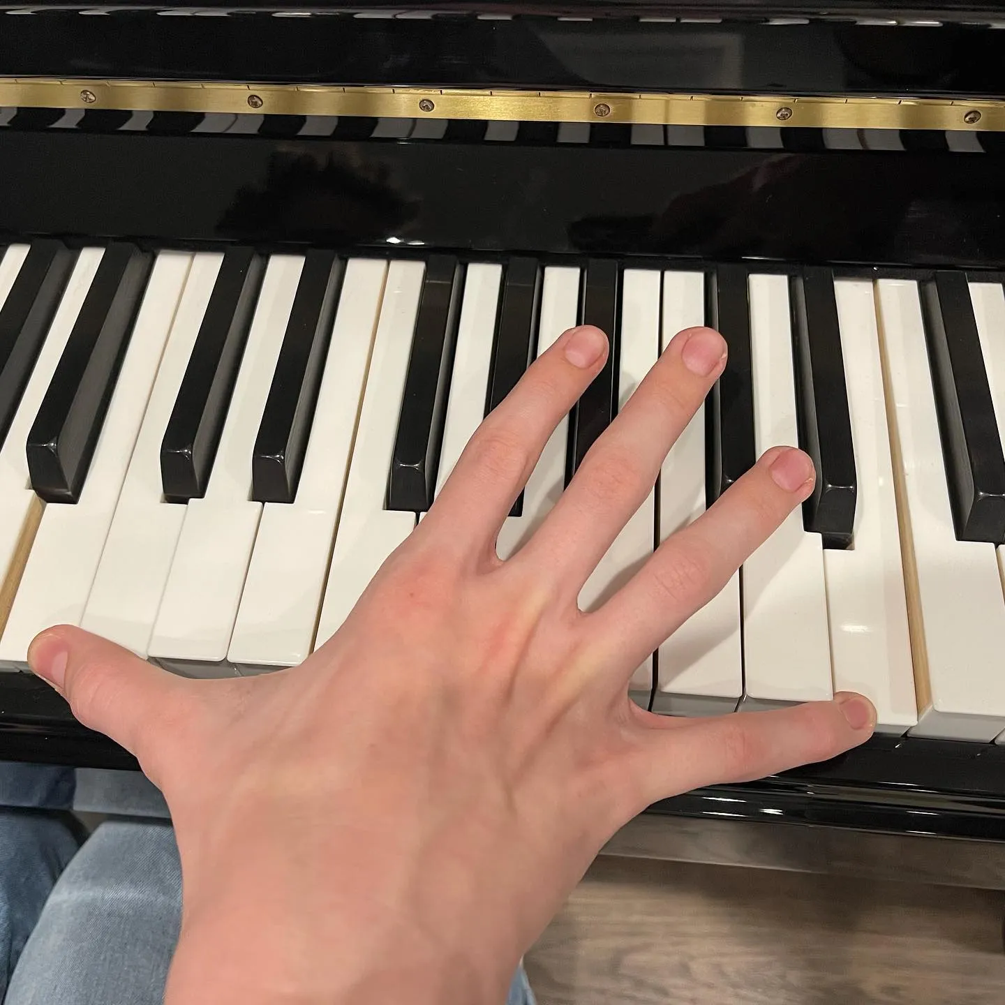 hand playing piano keys