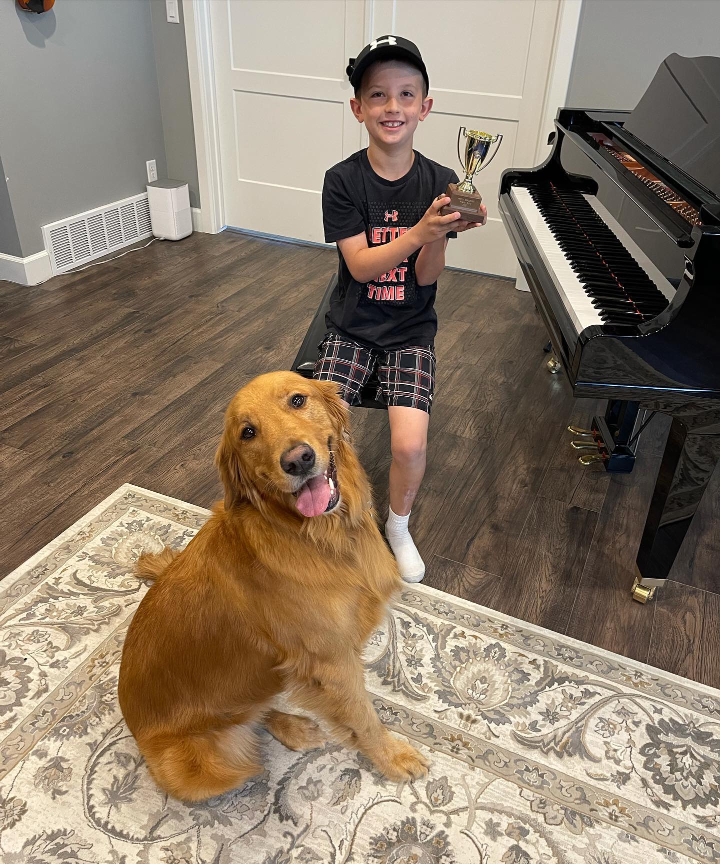 young boy and ollie at piano