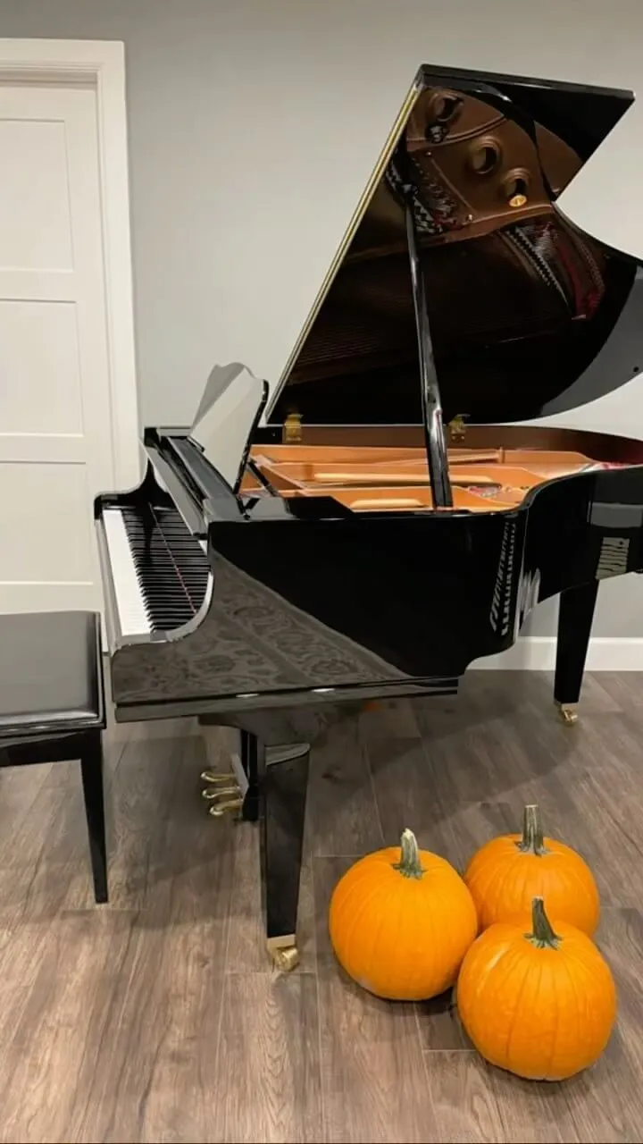 open grand piano with pumpkins