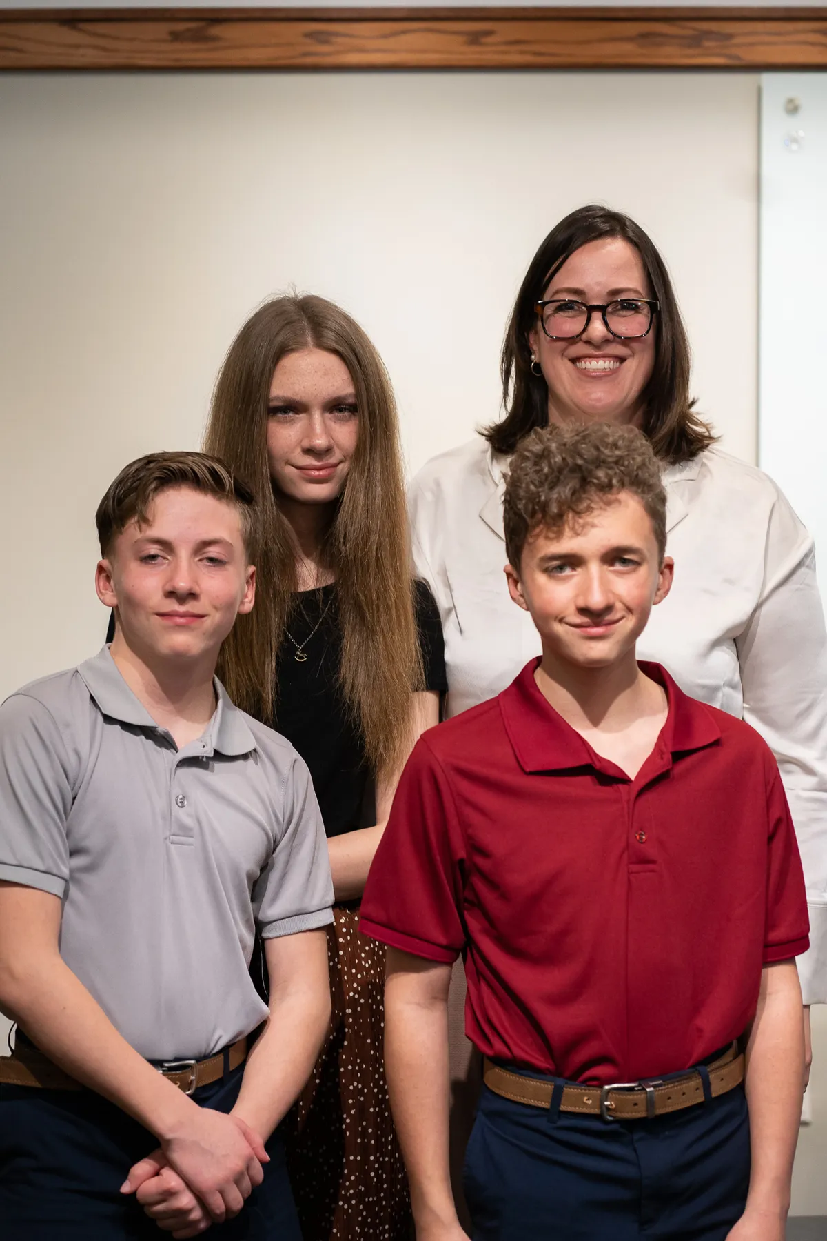 Jennifer Jackson smiling with piano students at recital